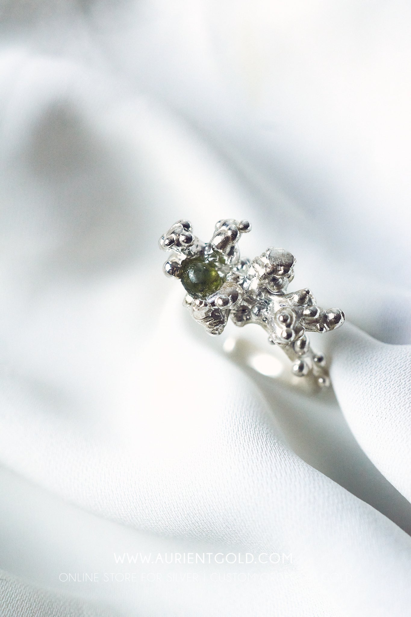 Coral sterling silver ring with green Sappire