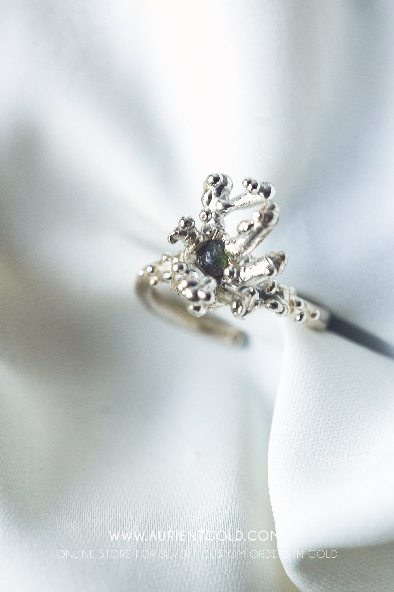 Coral sterling silver ring with green Sappire